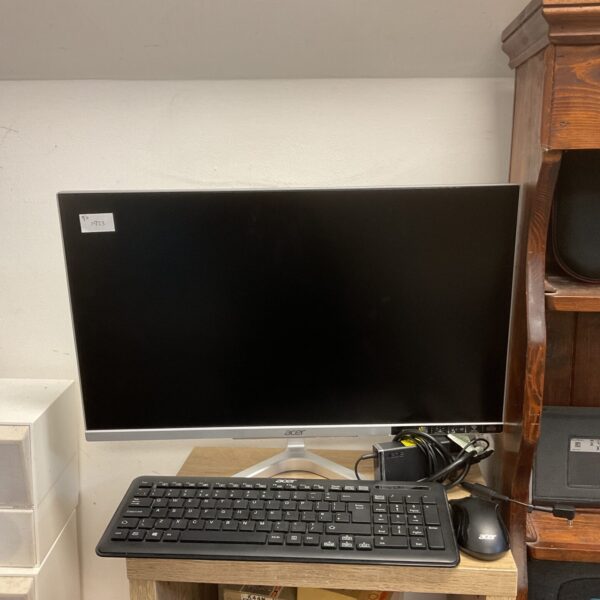 Acer Aspire C24 all-in-one computer with keyboard and mouse.