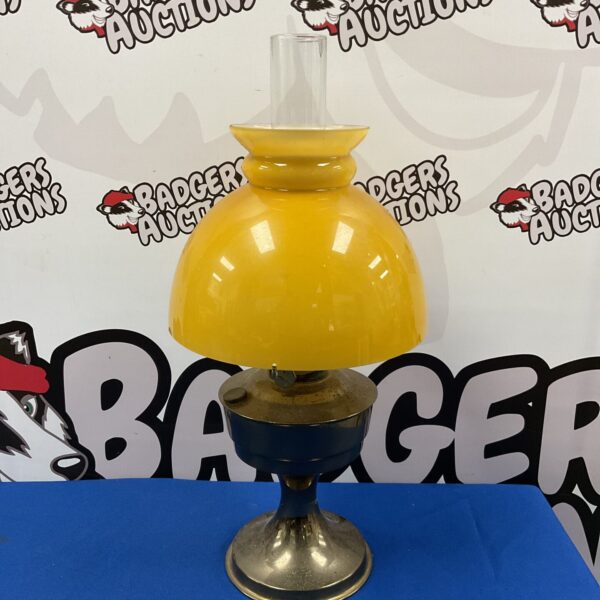 Vintage Aladdin paraffin lamp with orange glass shade.