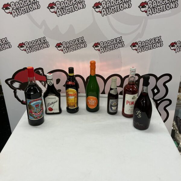 Selection of alcohol drinks including Pimm’s and Buck Fizz bottles.