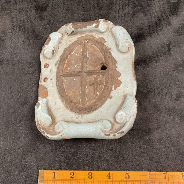 Antique cast iron door lock with floral detailing.