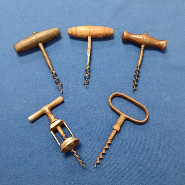 Antique corkscrew with wooden handle and metal helix.