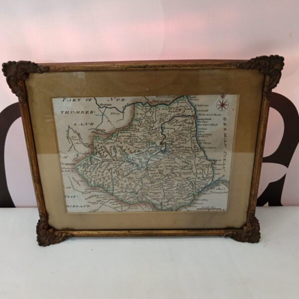 Antique map of Durham in ornate brass frame, vintage county cartography.