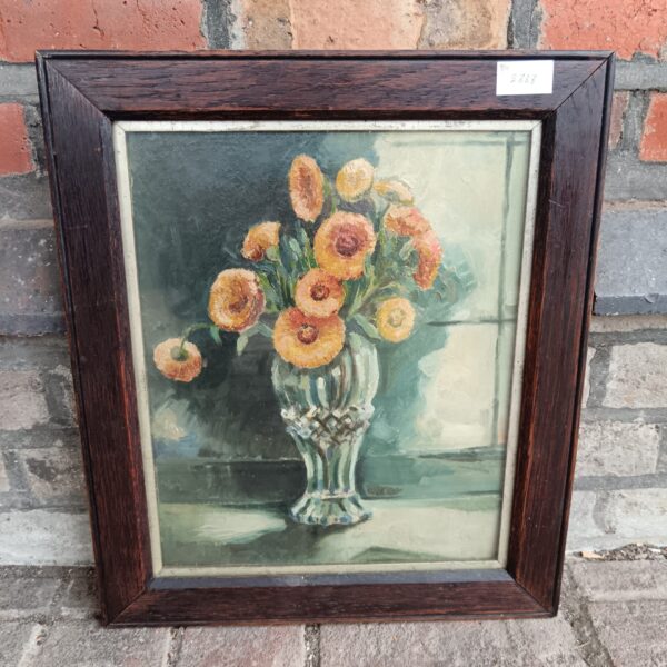 Antique floral still life oil painting in oak frame.
