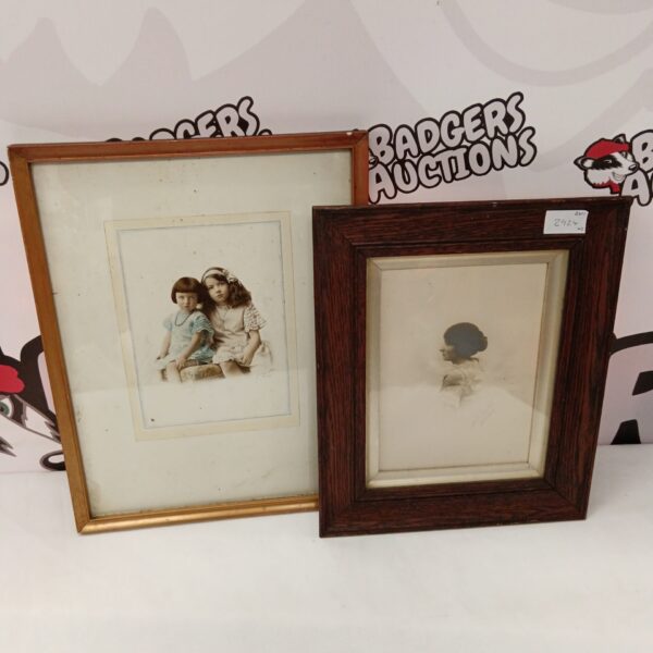 Two antique framed photographs in sepia tone.