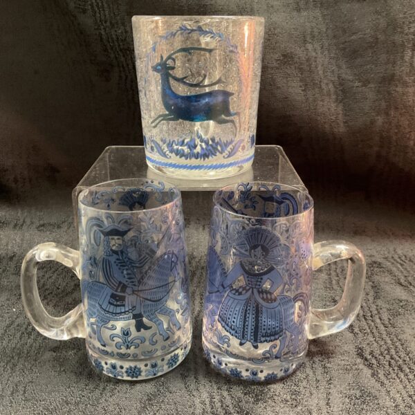 Group of antique German tankards with blue and white designs.