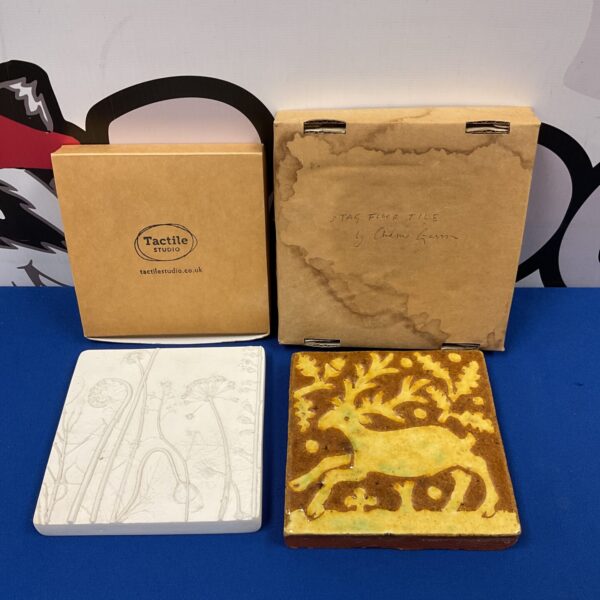 Antique glazed stag and floral tile pair, vintage ceramic decor.