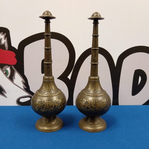 Antique Islamic rose water sprinklers with intricate brass detailing.