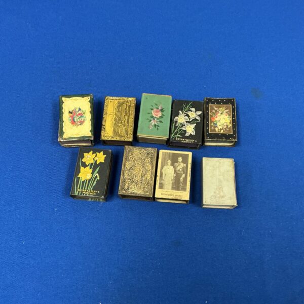 Antique matchbox collection with colourful vintage designs.