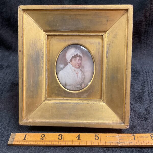 Antique 19th-century miniature portrait painting of a lady in a gilt frame.
