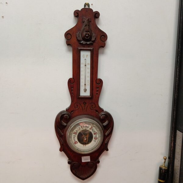 Antique oak mercury barometer with Fahrenheit scale.
