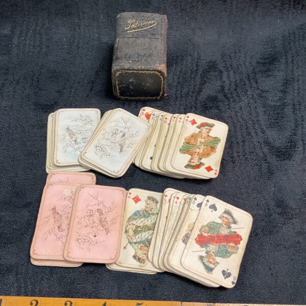 Antique Patience playing cards with leather case, vintage card game.