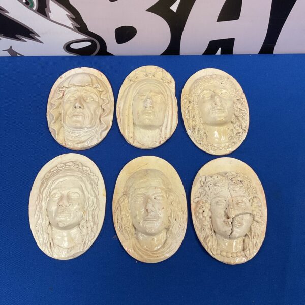 Antique plaster faces set, vintage wall decor and collectible art.