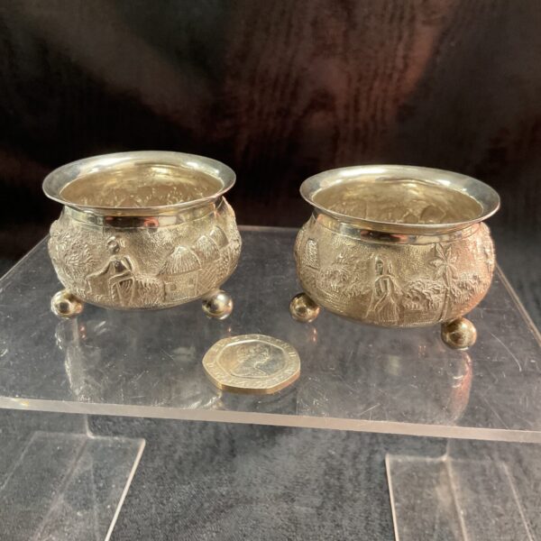 Antique silver bowl with detailed harvest scene repousse.
