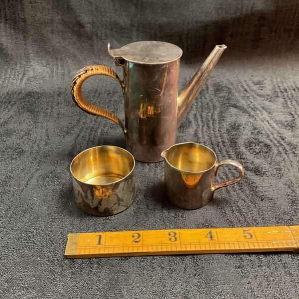 Antique silver plate coffee set with cream jug and sugar bowl.