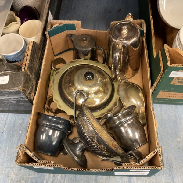Ornate antique silver plate coffee set with teapot and cups.