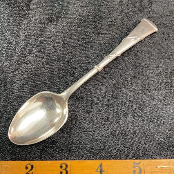 Antique silver spoon with twisted stem, Victorian silverware.