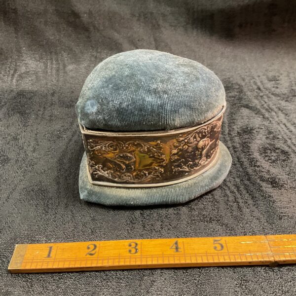 Antique velvet jewellery box with silver band, front view.