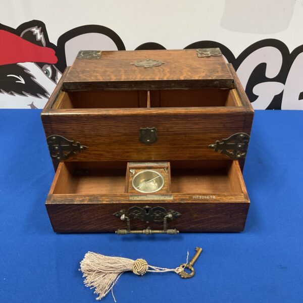 Antique Walter Oldfield smokers box with key, front view.