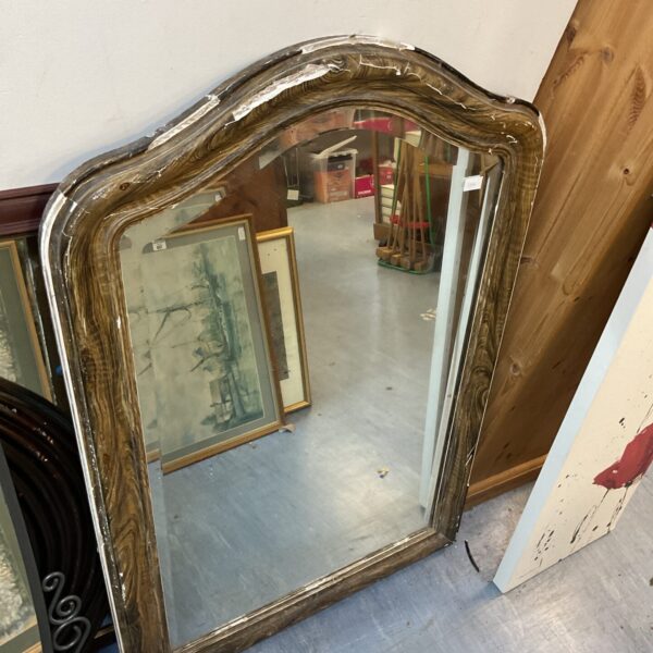 Large antique wooden framed mirror with ornate detailing.