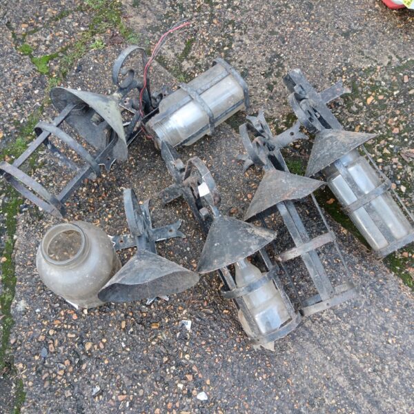 Lot of antique wrought iron lanterns with intricate detailing.