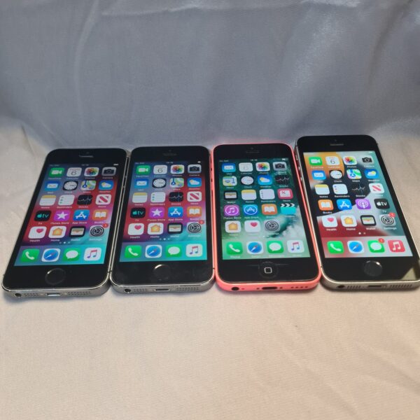 Group of four used Apple iPhones, models A1457 and A1507.