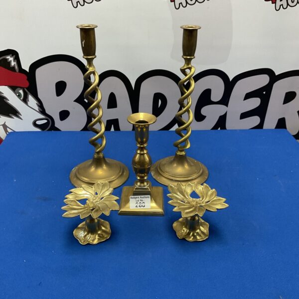 Vintage Art Nouveau brass candlesticks with a twisted design.