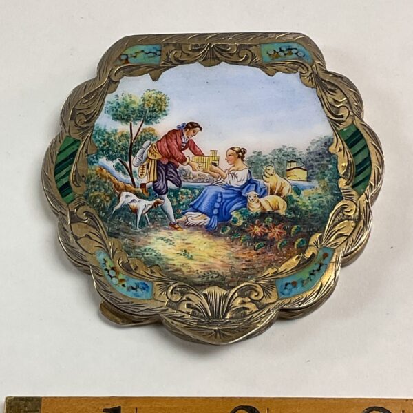 Vintage Art Nouveau enamel compact mirror with hand-painted scene.