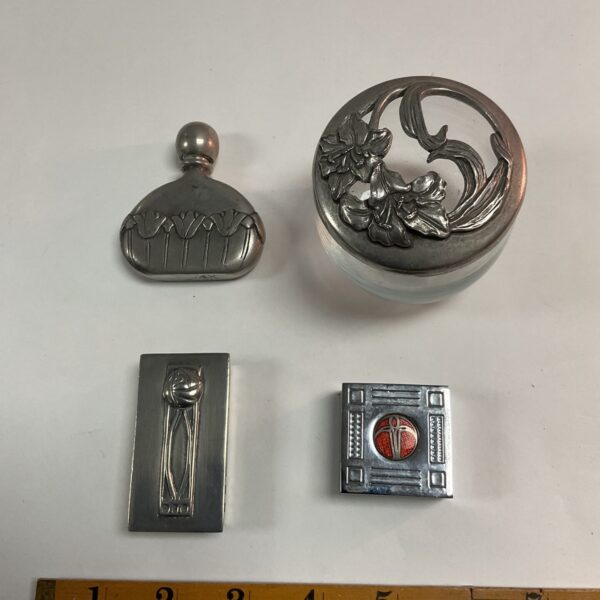 Intricate floral detail on antique Art Nouveau pill pot.