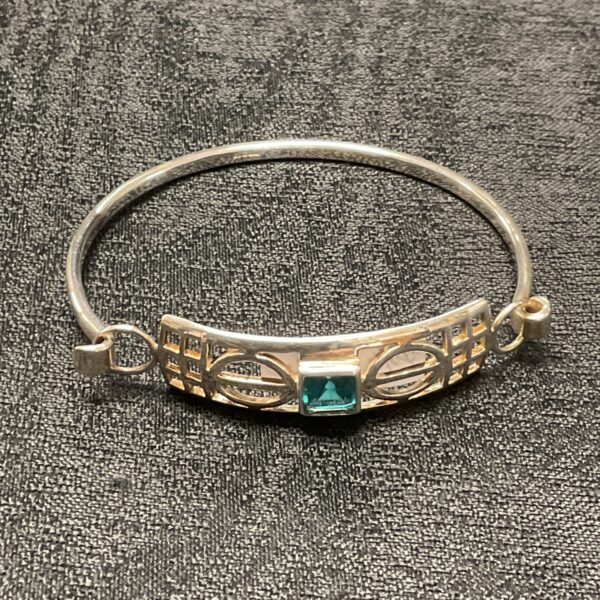 Vintage silver Art Nouveau bracelet with a vibrant topaz gemstone.