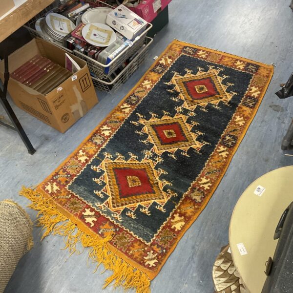 Vibrant patterned Asian style rug for home decor.