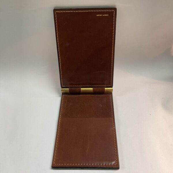 Vintage brown leather Asprey notepad case, open view.