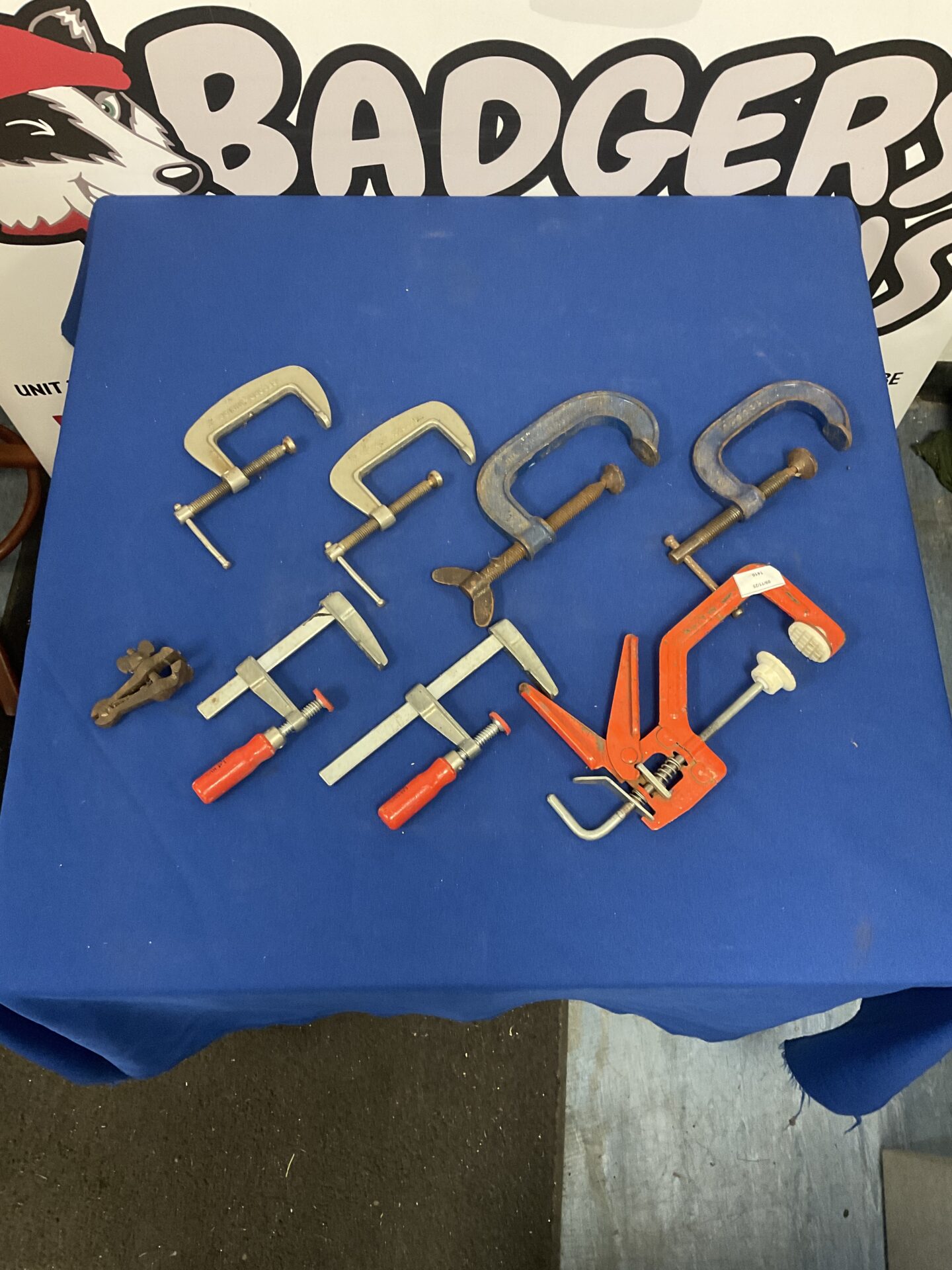 Vintage assorted clamps including Record brand woodworking tools.