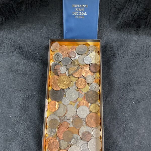 Blue tray filled with assorted British decimal coins for collectors.