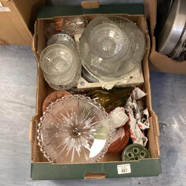 Assorted vintage glassware collection with colourful bowls and decorative pieces.