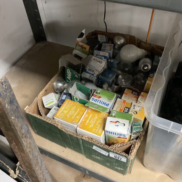 Tray of assorted new Philips light bulbs in original packaging.