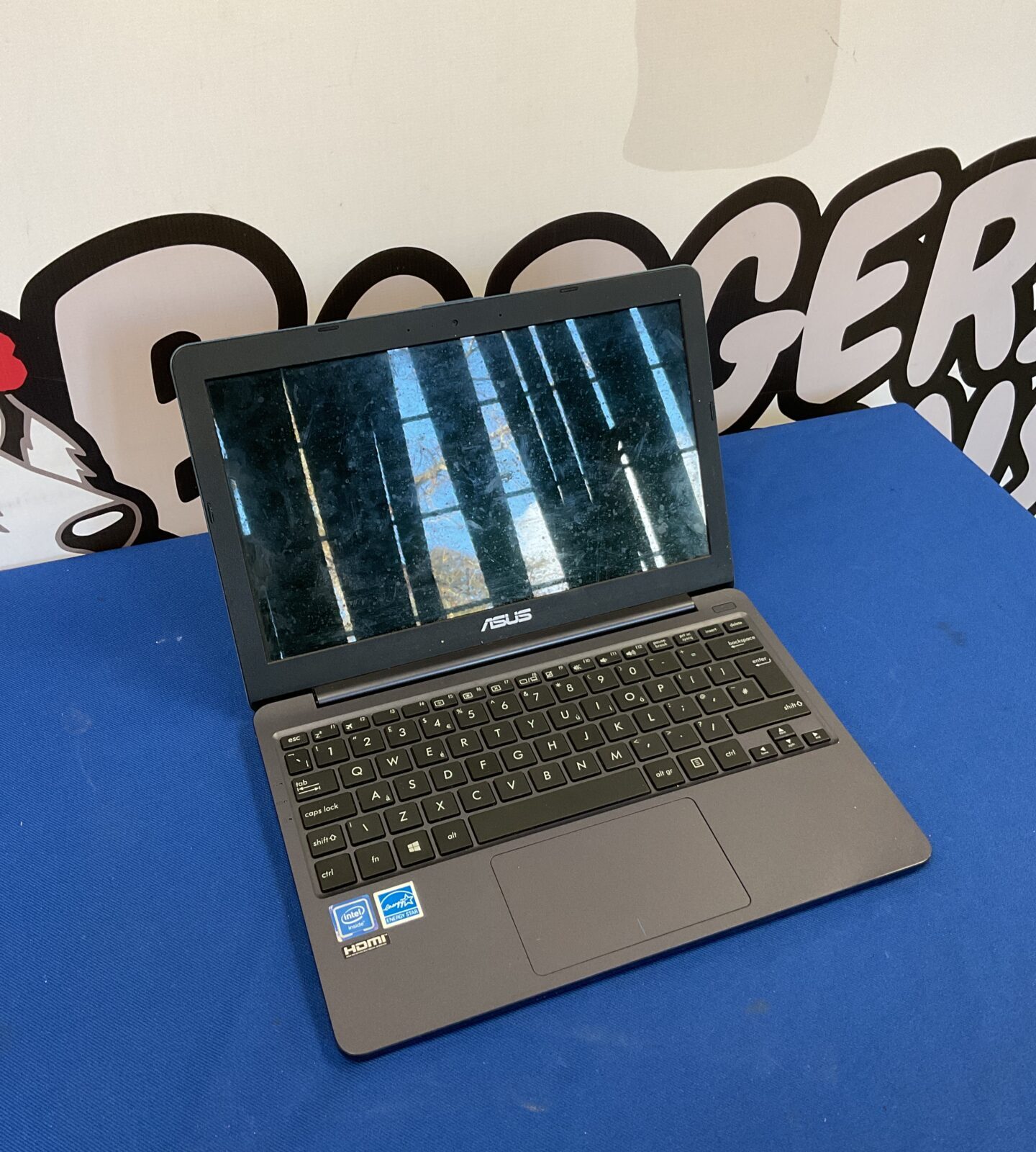 Asus Notebook PC model E203M – Badgers Auctions