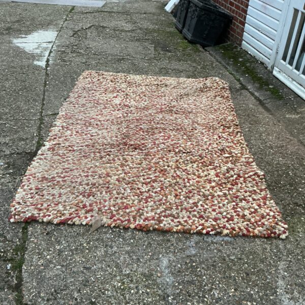 Patterned autumn coloured rug for home decor.