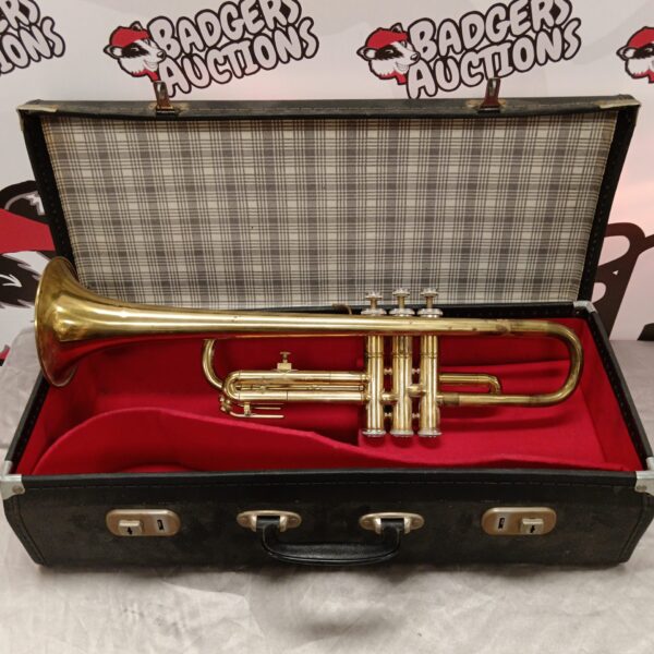 Vintage B Champion trumpet in its original case, a collectible brass instrument.