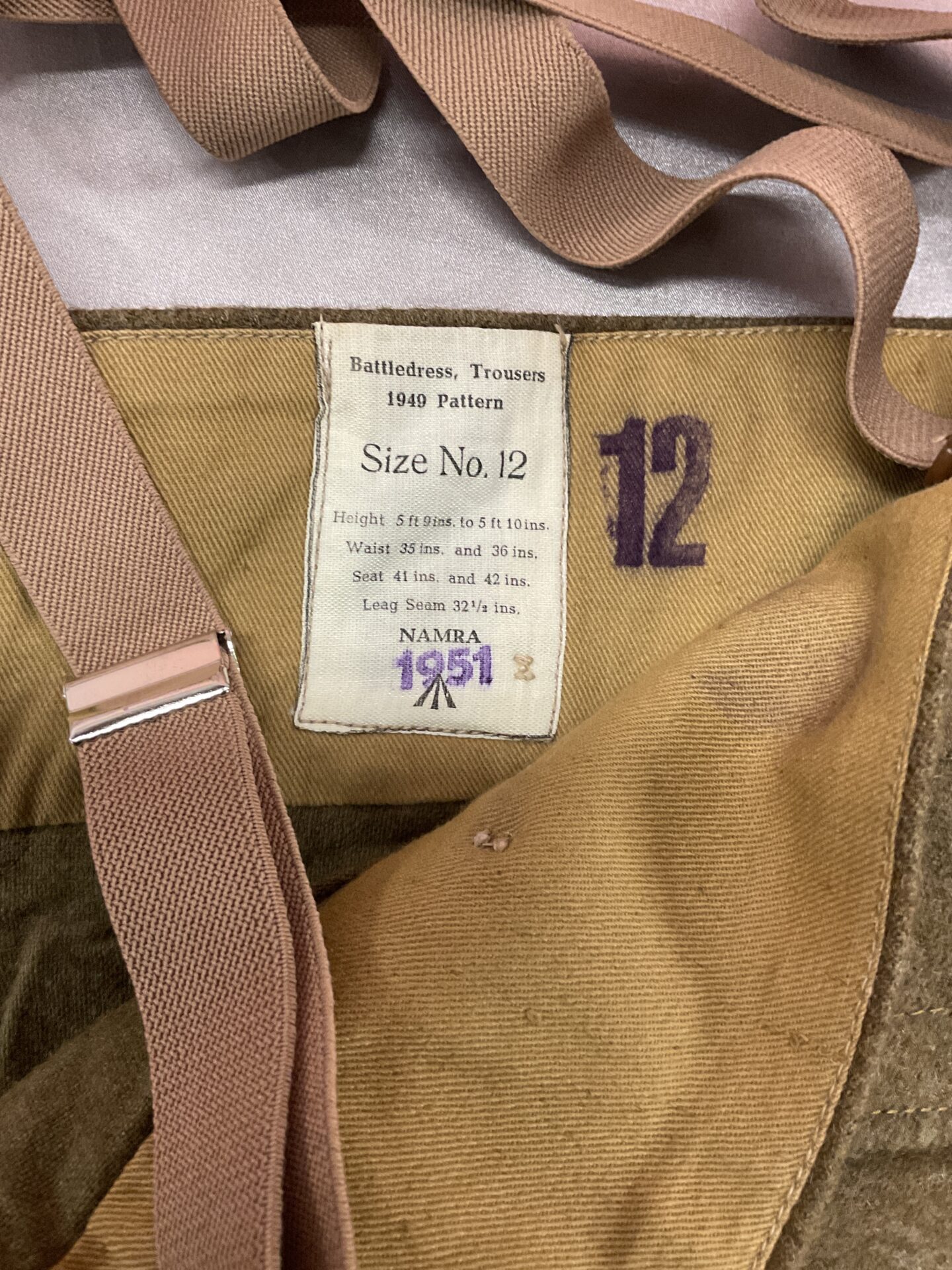Label on the Battle Dress trousers showing size 12 and 1951 date.