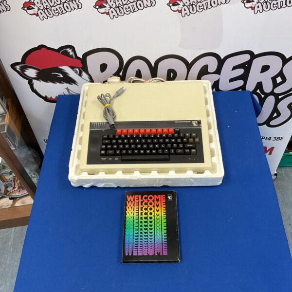 Vintage BBC Microcomputer with original welcome pack for retro computing enthusiasts.