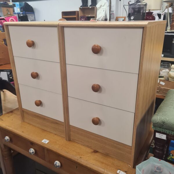 Pair of wooden beach effect bedside cabinets with drawers.