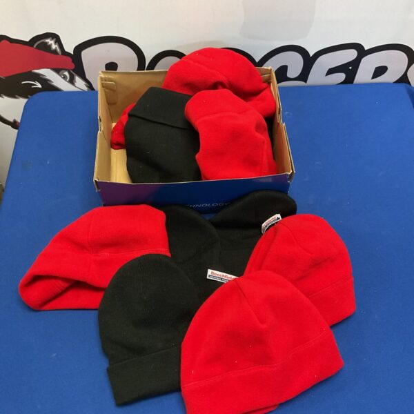 Lot of black and red beanie hats for winter warmth.