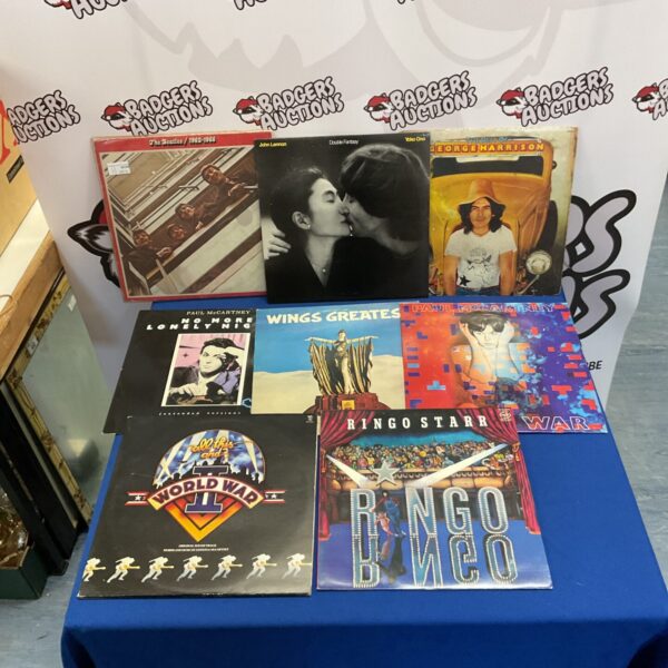 Vintage Beatles LP collection featuring vinyl records by John Lennon, George Harrison, and Ringo Starr.