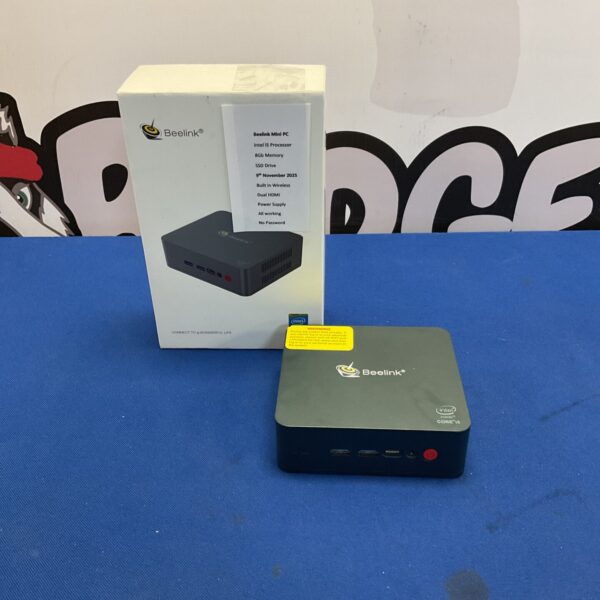 Beelink Mini PC with Intel Core i5 processor on a dark surface.