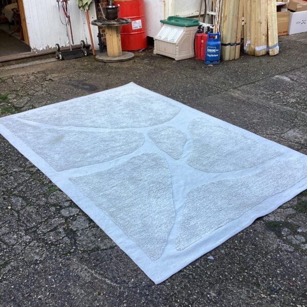 Large beige rug measuring 9ft x 6ft for living room decor.