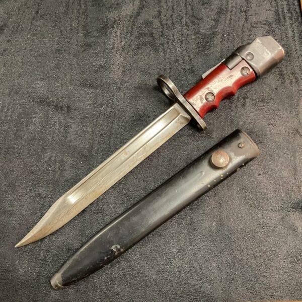 Vintage Belgium bayonet dated 1946 with red handle.