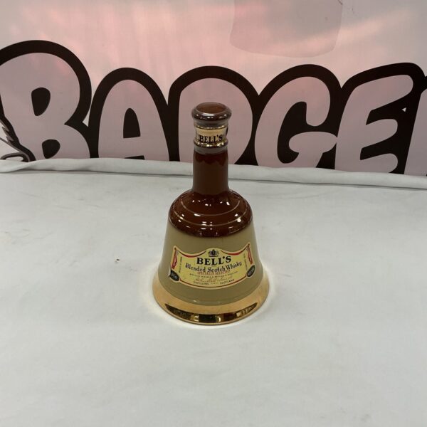 Vintage Bells Whisky decanter, ceramic collectible for display.