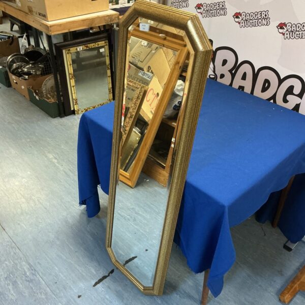 Vintage bevel edge hall mirror with ornate frame, ideal for hallway decor.