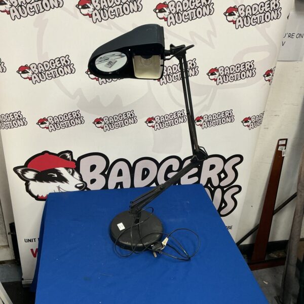Black vintage-style magnifying lamp with adjustable arm.