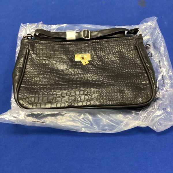 Black reptile style leather handbag, classic fashion accessory.